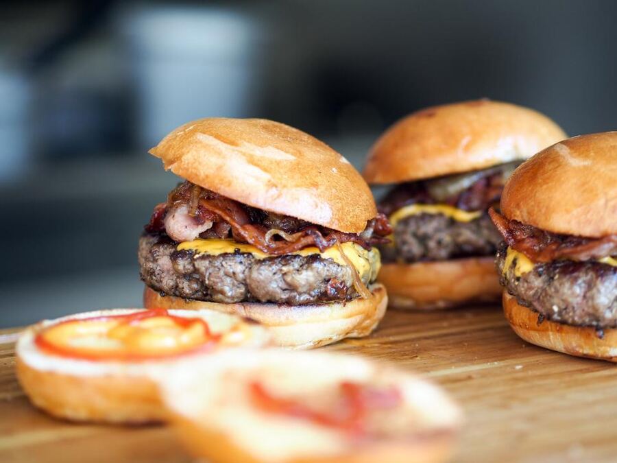 Smash burgers on a wooden board